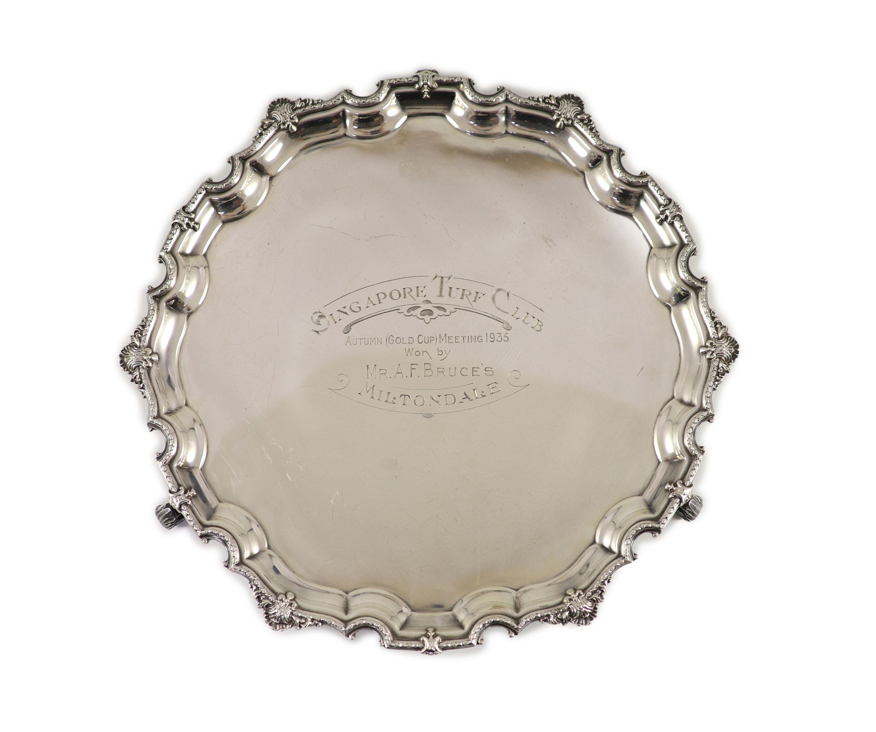 A George V shaped circular salver with '1935 Singapore Turf Club' engraved inscription